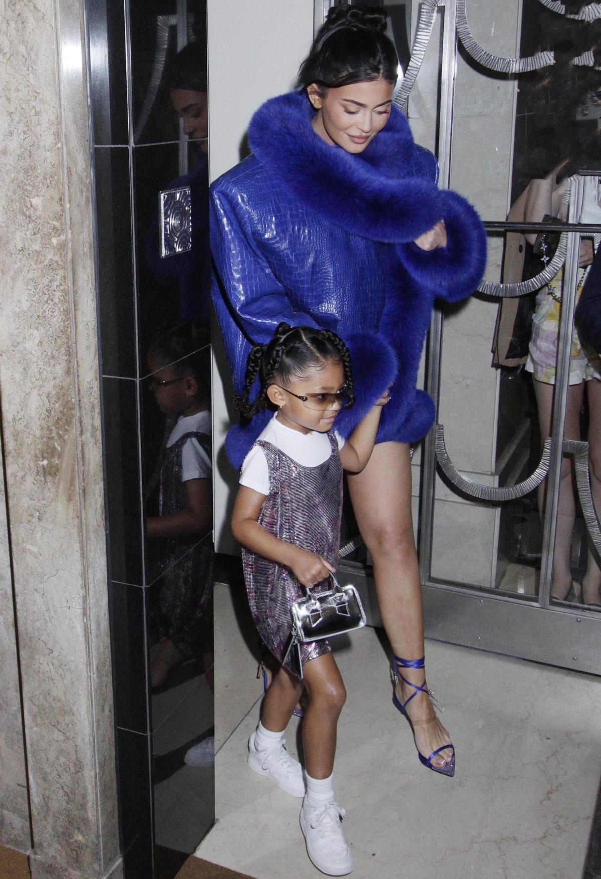 Kylie Jenner wearing an Alexandre Vauthier Fall 2022 Haute Couture leather coat with daughter Stormi Webster at Claridge’s