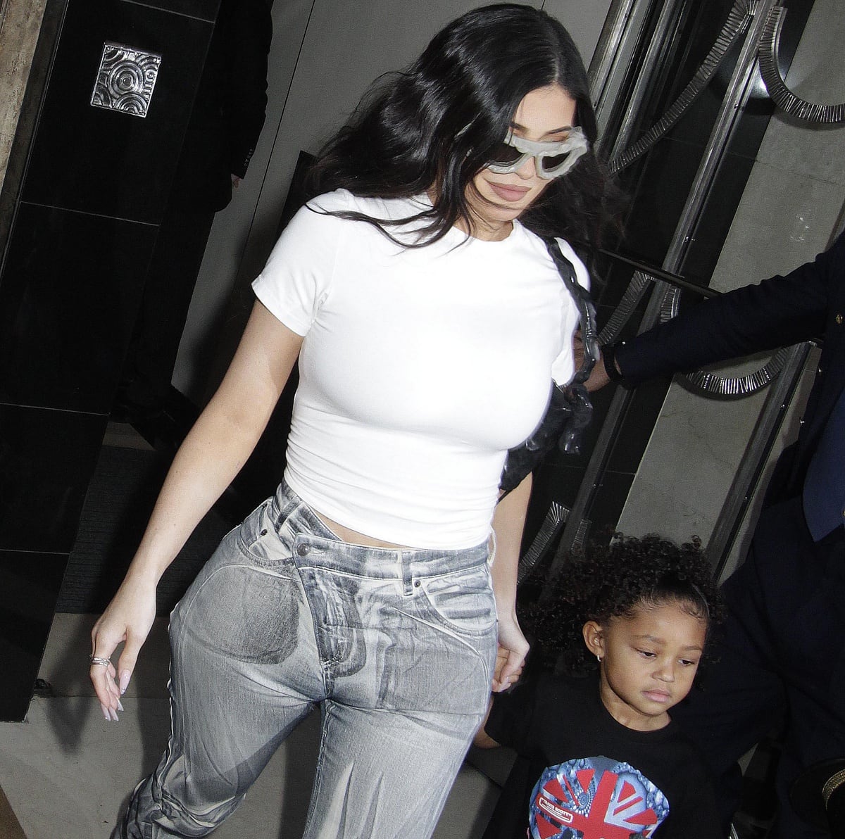 Kylie Jenner in Ottolinger jeans with daughter Stormi Webster at the O2 Arena for boyfriend Travis Scott’s show