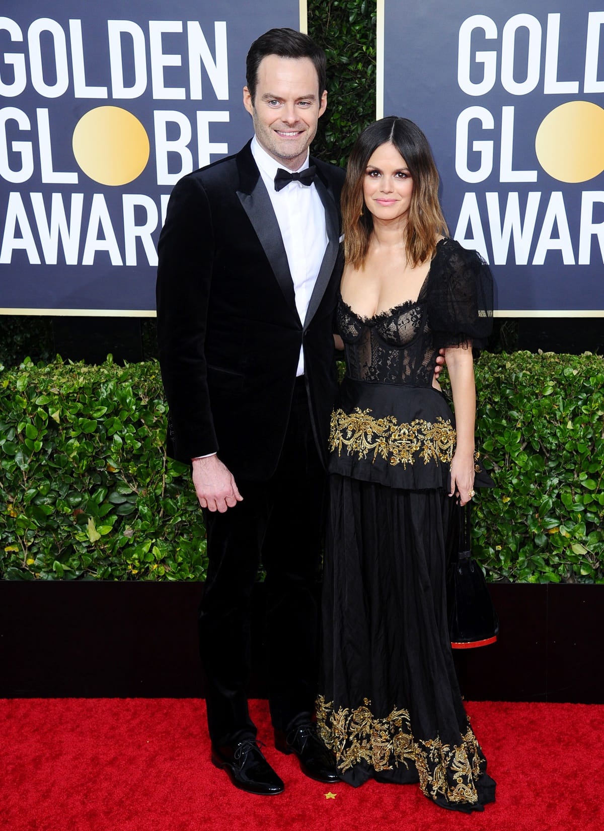 Bill Hader looked dashing in a black velvet Dior tuxedo with a bowtie, while Rachel Bilson stunned in a medieval-inspired black lace gown by the Brock Collection, paired with smoky eye makeup and beachy waves