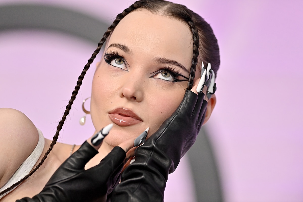 Dove Cameron opts for gothic-glam with graphic eyeliner and face-framing plaits