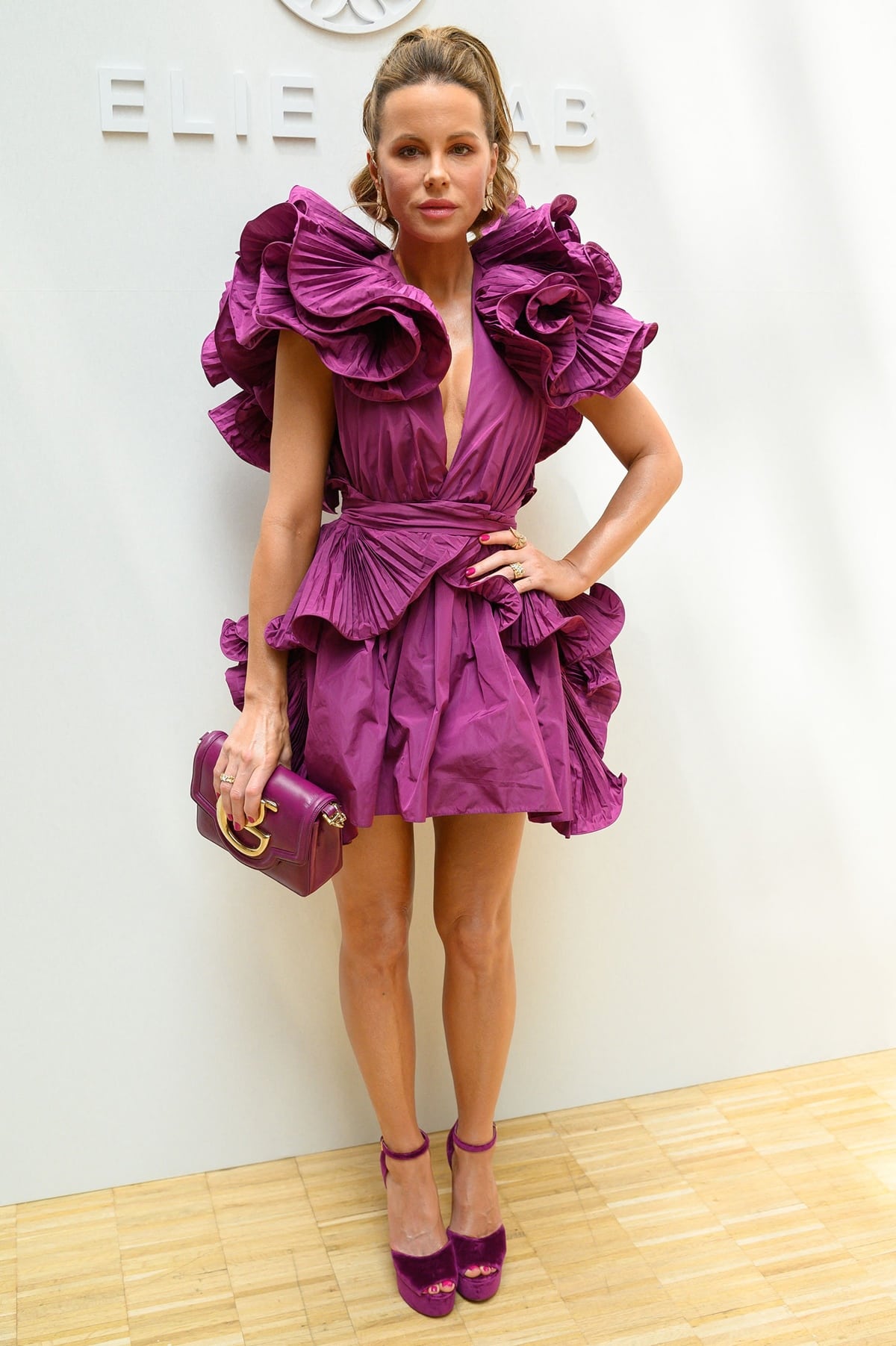Kate Beckinsale flaunts her legs in a rosy mini dress at the Elie Saab Haute Couture Fall Winter 2022 2023 show