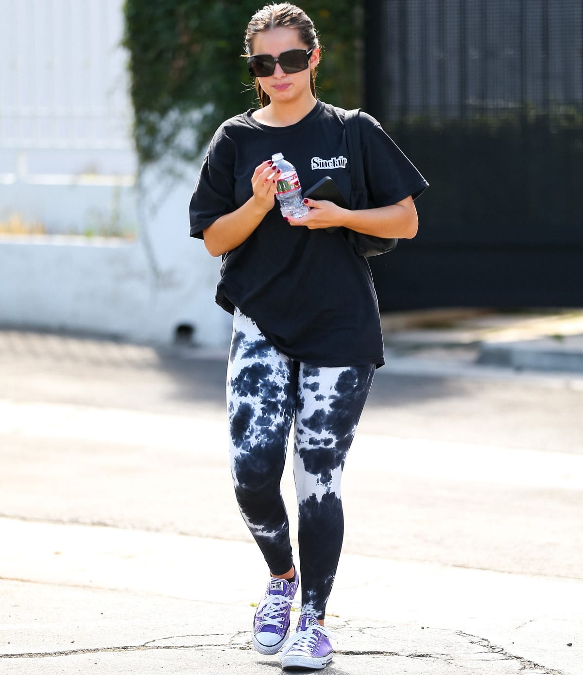 Addison Rae going to a Pilates class in purple Converse Chuck Taylor All Star sneakers