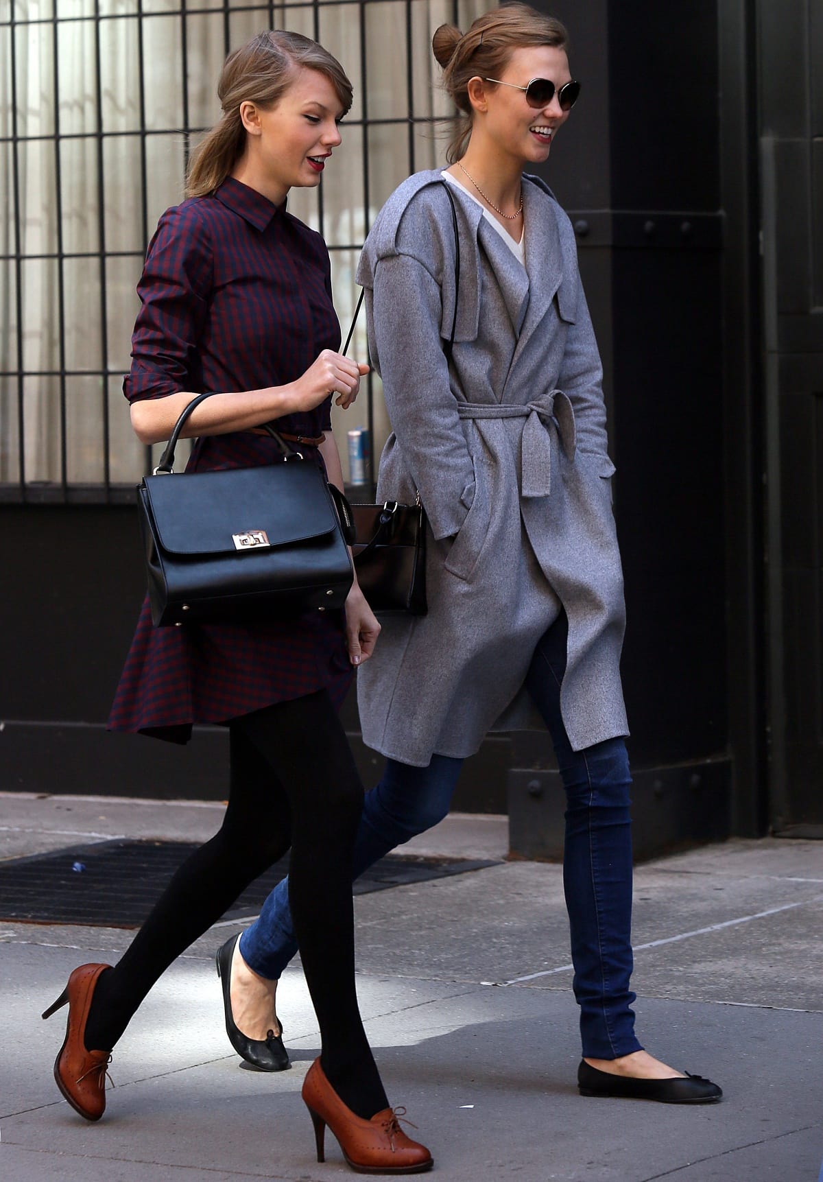 Taylor Swift in a burgundy plaid shirtdress with brown oxford heels and Karlie Kloss in a belted gray coat with black ballet flats were spotted walking together in New York City on April 3, 2014