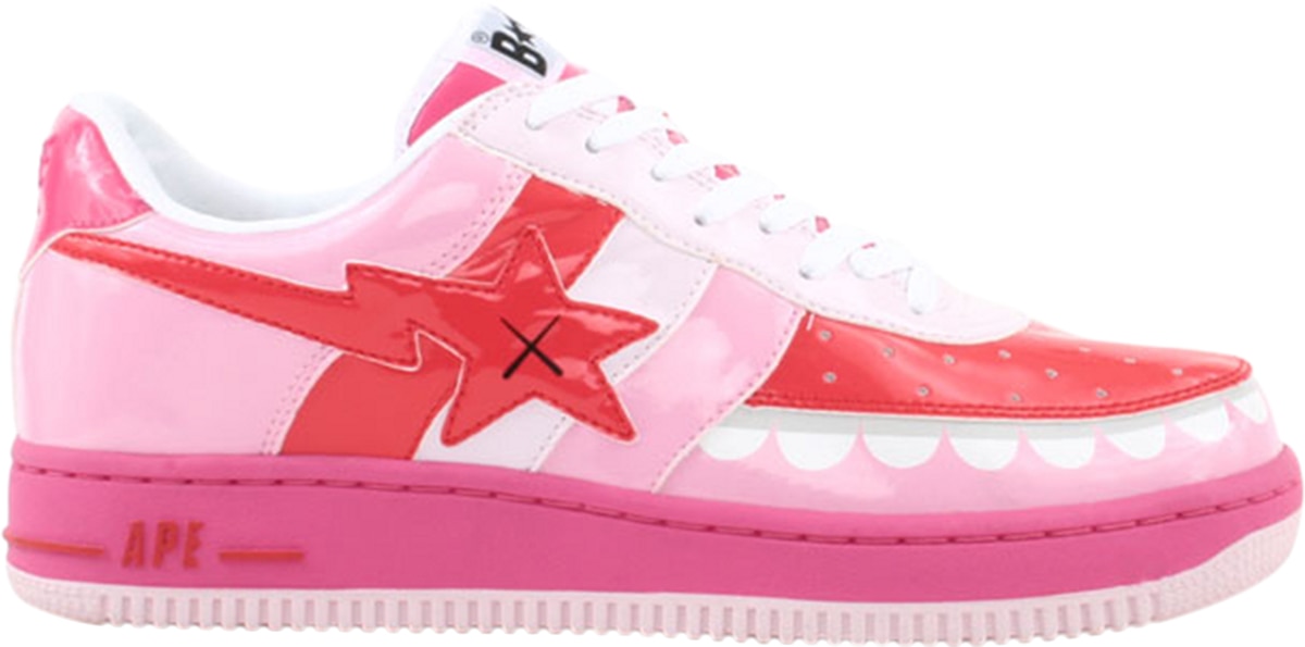The Kaws x Bapesta FS-029 Low Chompers are done in patent leather with striped midfoot paneling, a signature teeth motif around the toe, and Kaws' 'X' graphics on the lightning bolt