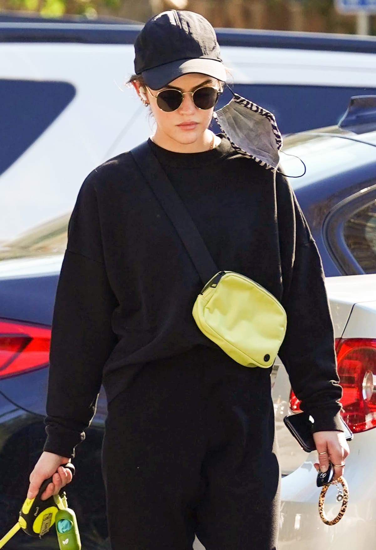 Lucy Hale effortlessly styles a yellow Lululemon Everywhere belt bag, adding a pop of color to her casual look