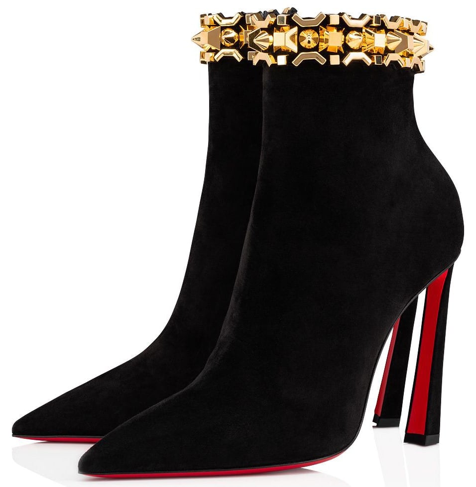 The Asteroispikes booties feature a sleek upper made from black veau velours, gold-tone Art Deco spikes along the opening, and slanting heels