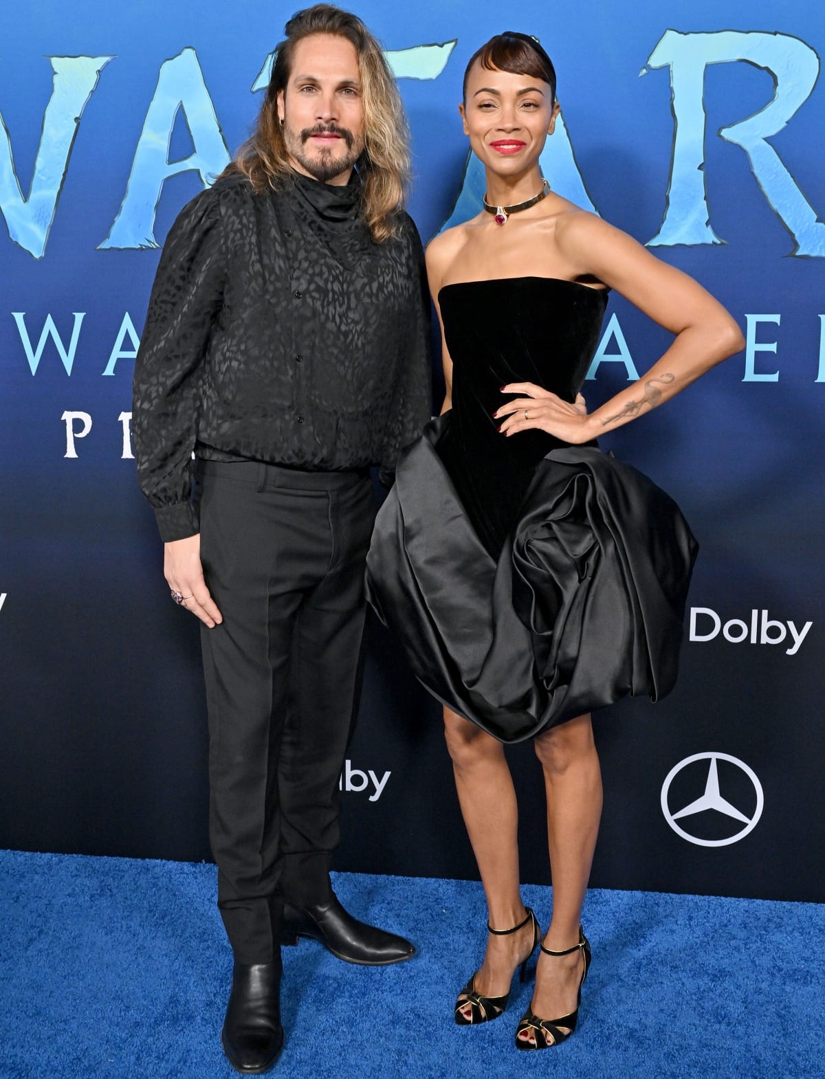 Zoe Saldaña with husband Marco Perego in matching all-black looks at the Los Angeles premiere of Avatar: The Way of Water