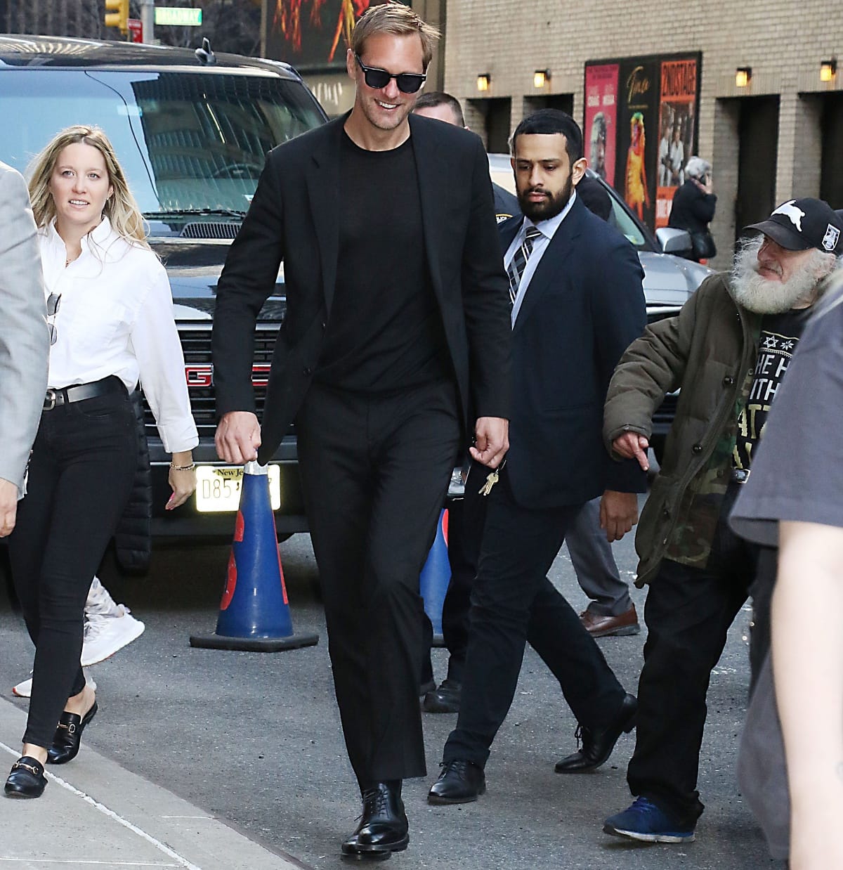 Alexander Skarsgård, standing at 6'4 ¼" (193.7 cm), cut a sleek figure in an all-black ensemble and polished leather shoes as he arrived at The Late Show with Stephen Colbert in New York, effortlessly towering over the crowd with movie-star ease