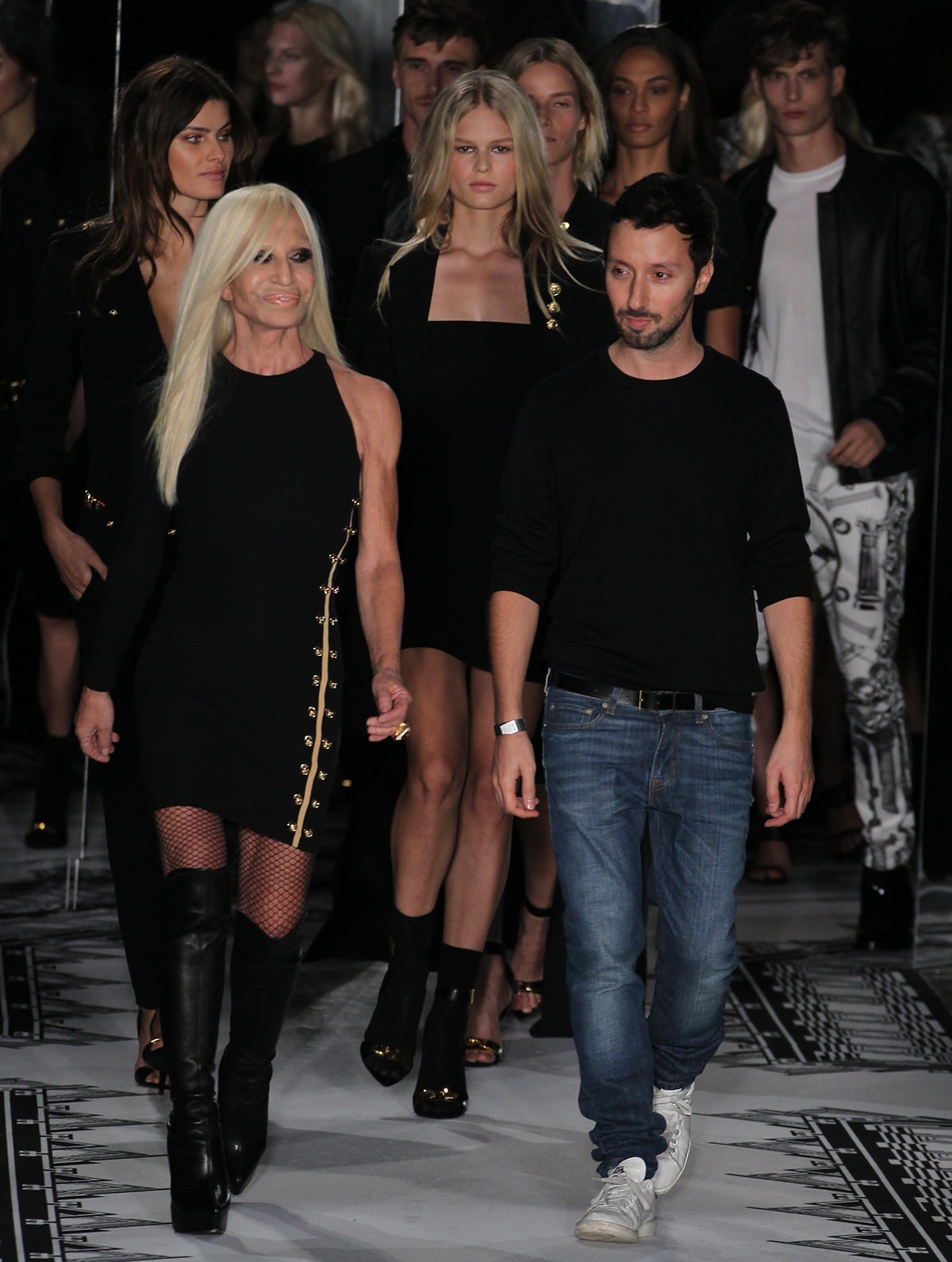 Donatella Versace and Anthony Vaccarello walk the runway at the Versus Versace Spring 2015 fashion presentation