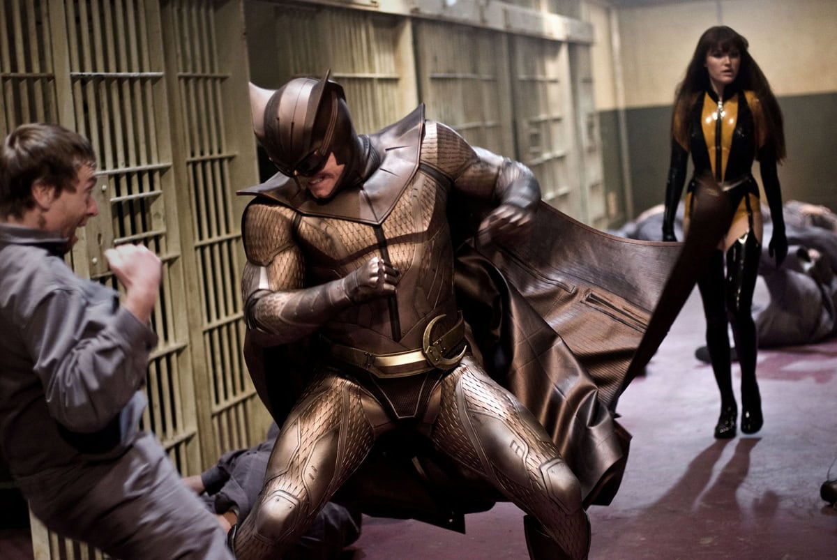 Malin Åkerman’s Silk Spectre II costume was finished with glossy black thigh-high boots on razor-sharp stiletto heels, amplifying the character’s fierce, hyper-stylized power