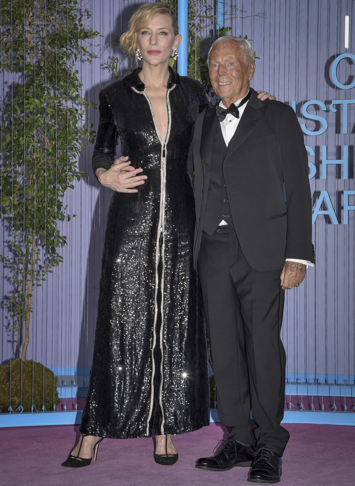 Cate Blanchett, in a black sequin Armani Fall 2012 jumpsuit and Aquazzura “Cha Cha Cha” earrings, with Giorgio Armani in Milan on September 25, 2022