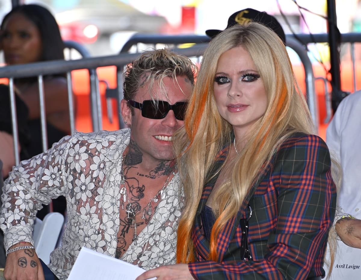 Avril Lavigne and Mod Sun shared a proud moment at her Hollywood Walk of Fame ceremony, with Avril wearing a nostalgic plaid Vivienne Westwood ensemble that perfectly balanced her punk roots and polished confidence
