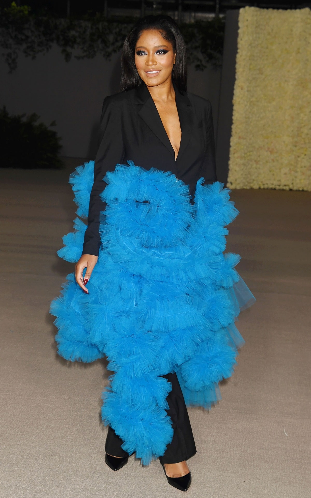 Keke Palmer turned heads in a sculptural black-and-blue Act N°1 ensemble styled by Law Roach, grounding the look with sleek black pointed-toe pumps at the 2nd Annual Academy Museum Gala