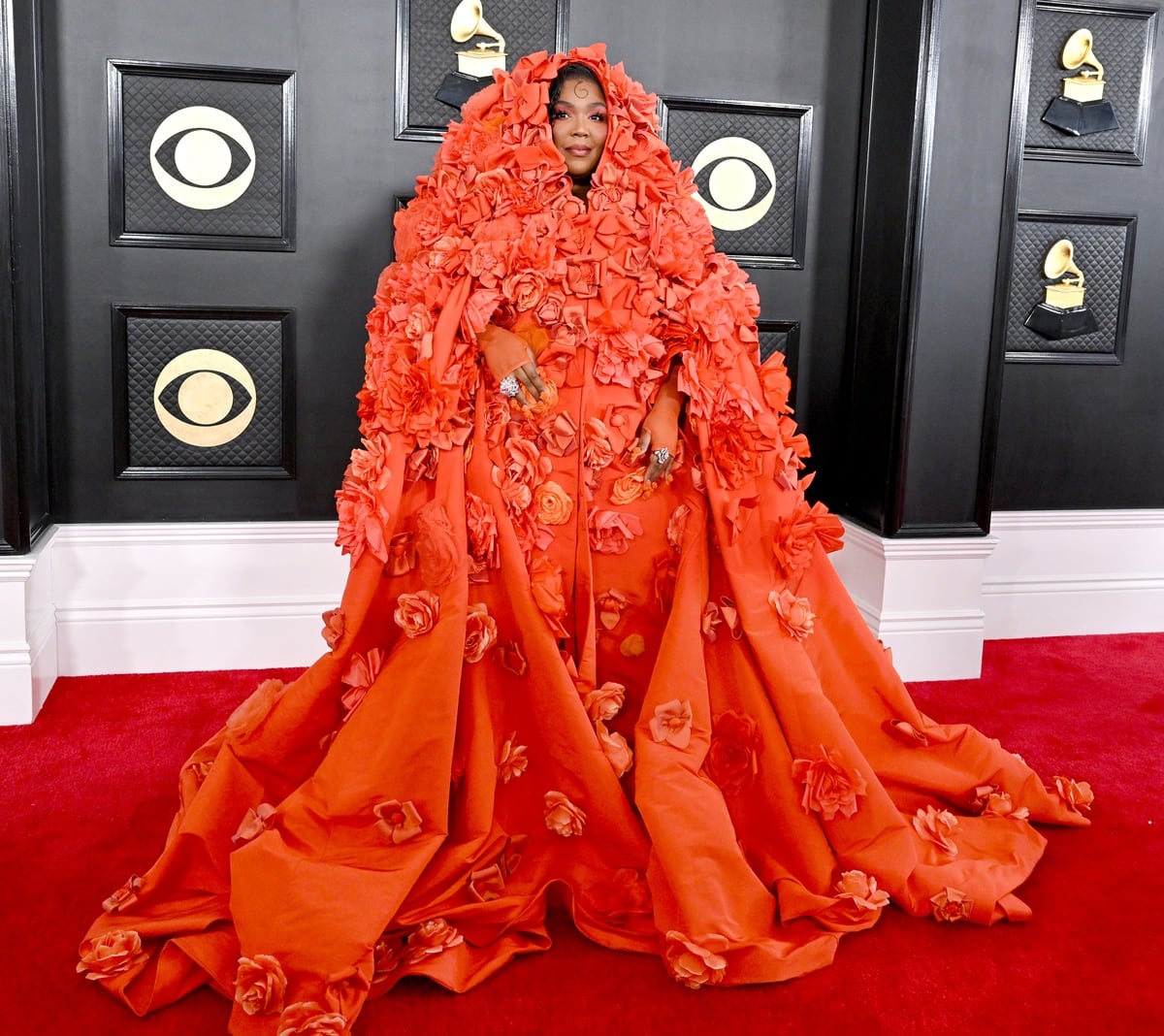 Lizzo turned up to the 65th annual Grammy Awards in an orange Dolce Gabbana ensemble covered in hand-embroidered silk flowers