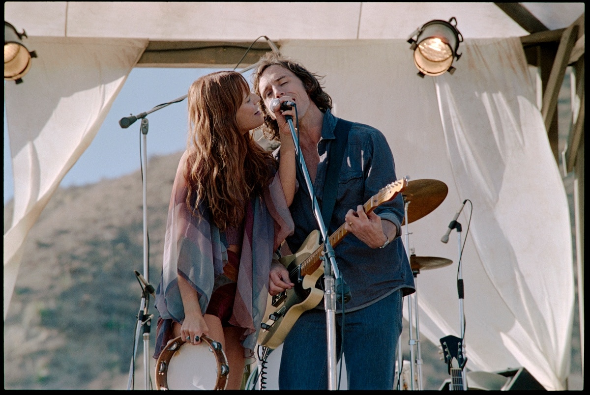 Riley Keough as Daisy Jones and Sam Claflin as Billy Dunne in the upcoming streaming television miniseries Daisy Jones The Six