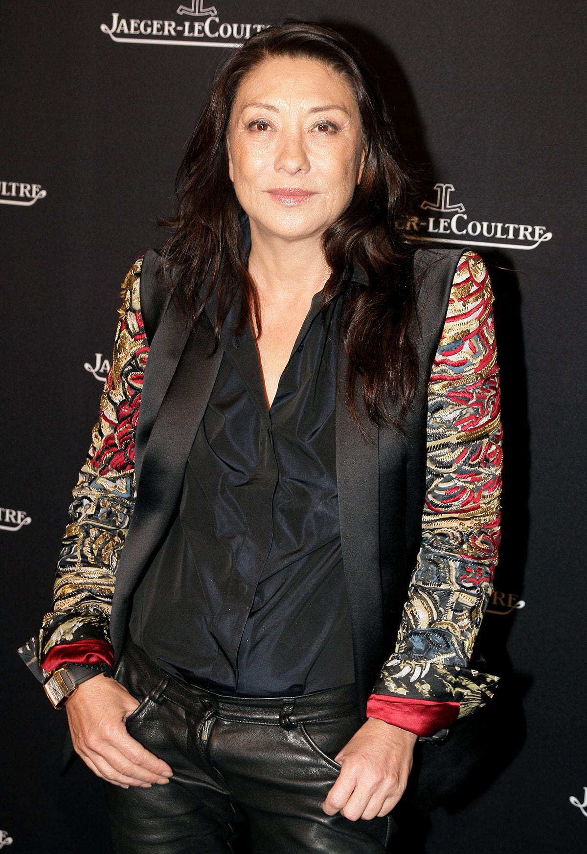 Barbara Bui attends a Jaeger-LeCoultre event wearing her signature rock-chic look, pairing an embroidered jacket with a draped black blouse and leather trousers