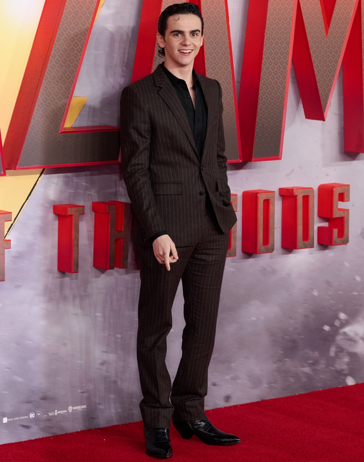 Jack Dylan Grazer looks sharp in a pinstripe suit as he attends the red carpet premiere of Shazam! Fury of the Gods