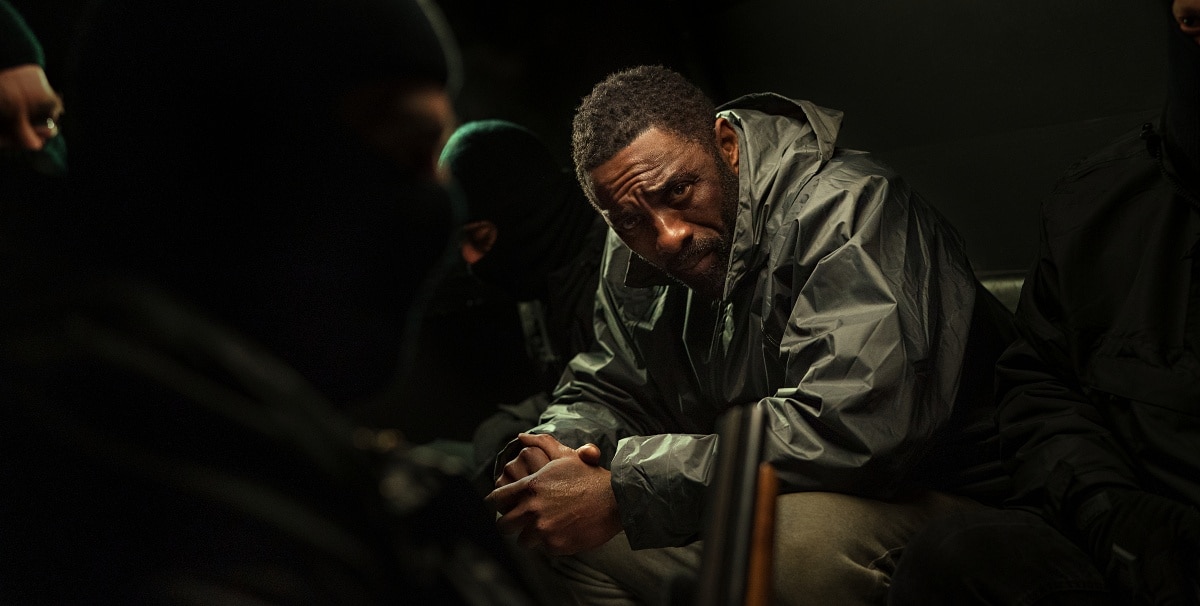 Idris Elba returns as the brooding detective John Luther, captured in a tense moment from the 2023 crime thriller Luther: The Fallen Sun