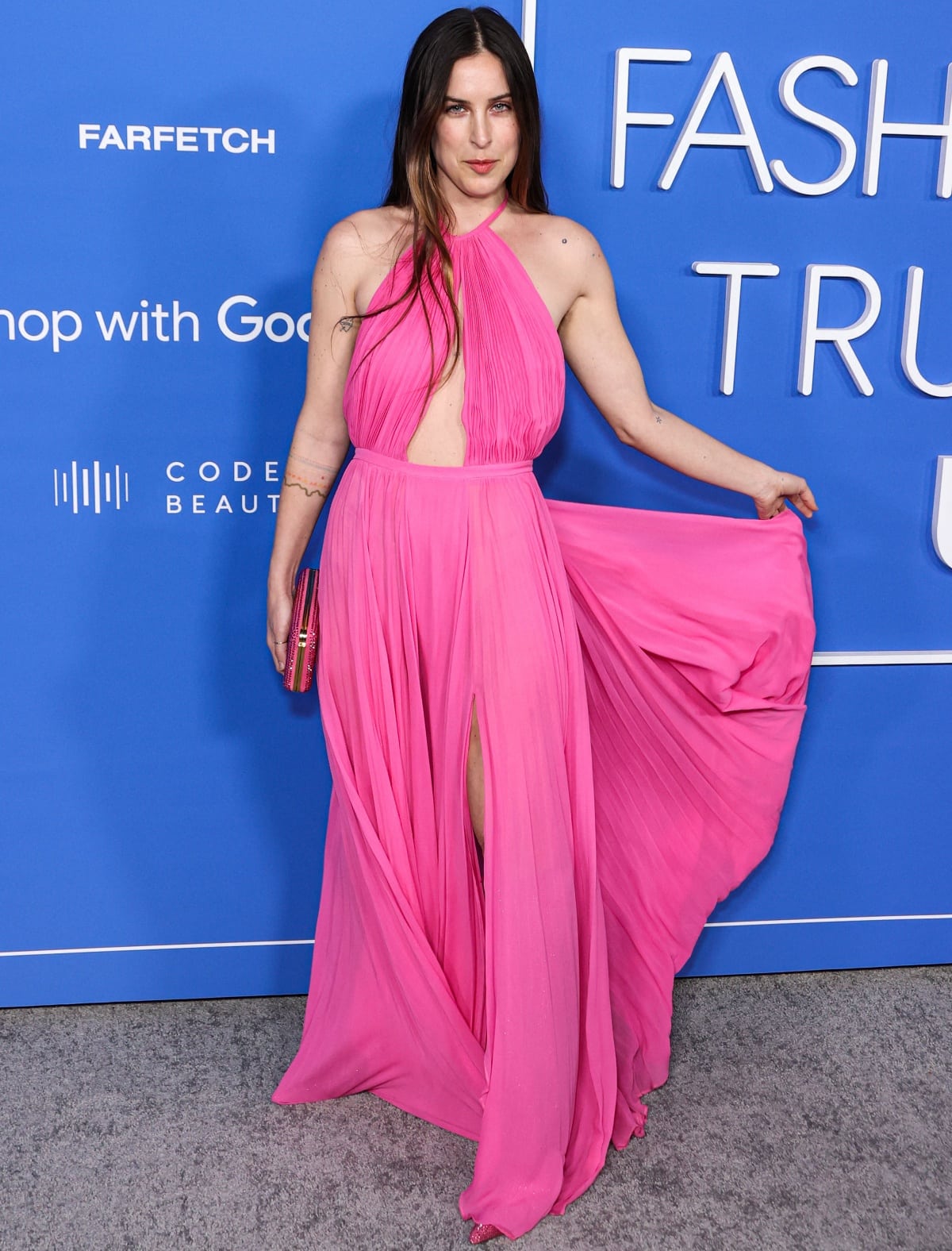 Scout LaRue Willis exudes playful elegance in a flowing Barbie-pink chiffon halter gown paired with sparkling pink platform heels at the 2023 Fashion Trust U.S. Awards