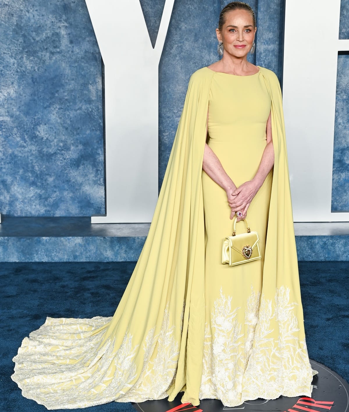 Sharon Stone looked every bit the movie star in her radiant yellow Tony Ward Fall 2017 Couture archive gown with a matching Dolce Gabbana bag and Giorgio B jewelry at the 2023 Vanity Fair Oscar Party