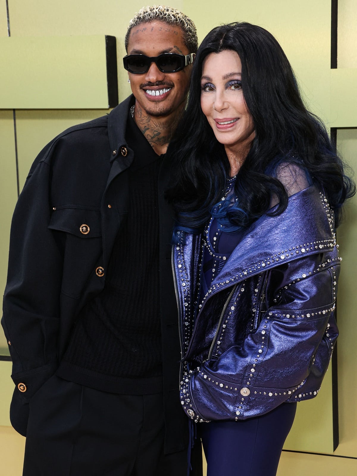 Cher with her boyfriend Alexander "A.E." Edwards, a music producer and Def Jam AR executive who is 40 years her junior, at the Versace FW23 Show