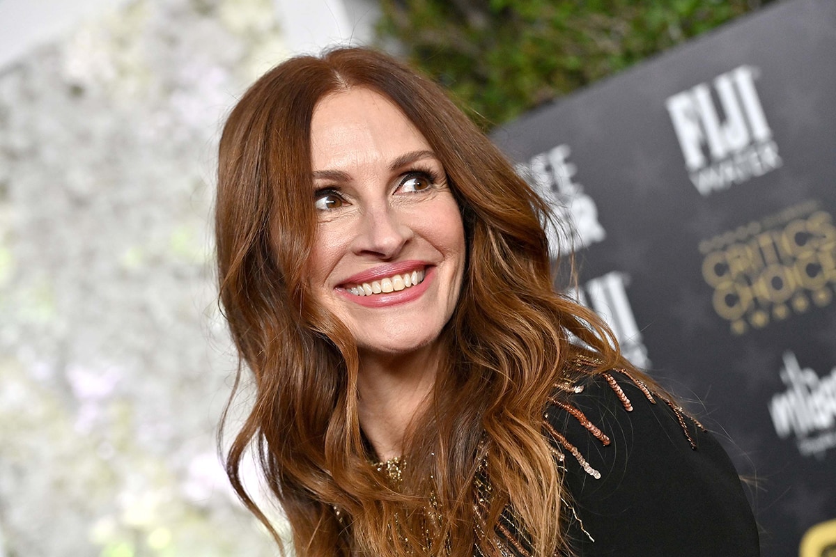 Julia Roberts beams on the red carpet, the star who was originally tapped to play Hannah Michaels in The Last Thing He Told Me before the role went to Jennifer Garner