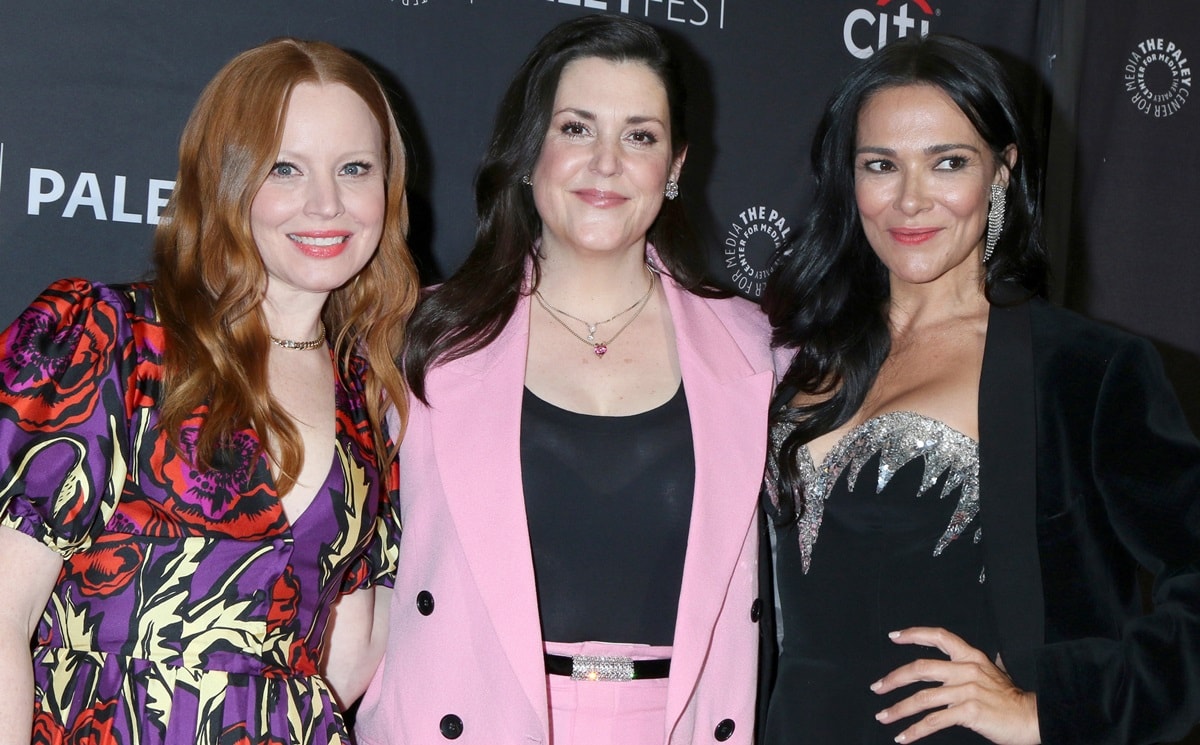 (L-R) Lauren Ambrose stuns in a bold floral-print dress, Melanie Lynskey opts for a chic pastel pink suit with a sparkling belt, and Simone Kessell dazzles in a black velvet blazer over a shimmering silver-accented dress at PaleyFest LA 2023 - 'Yellowjackets' at Dolby Theatre on April 3, 2023, in Hollywood, California