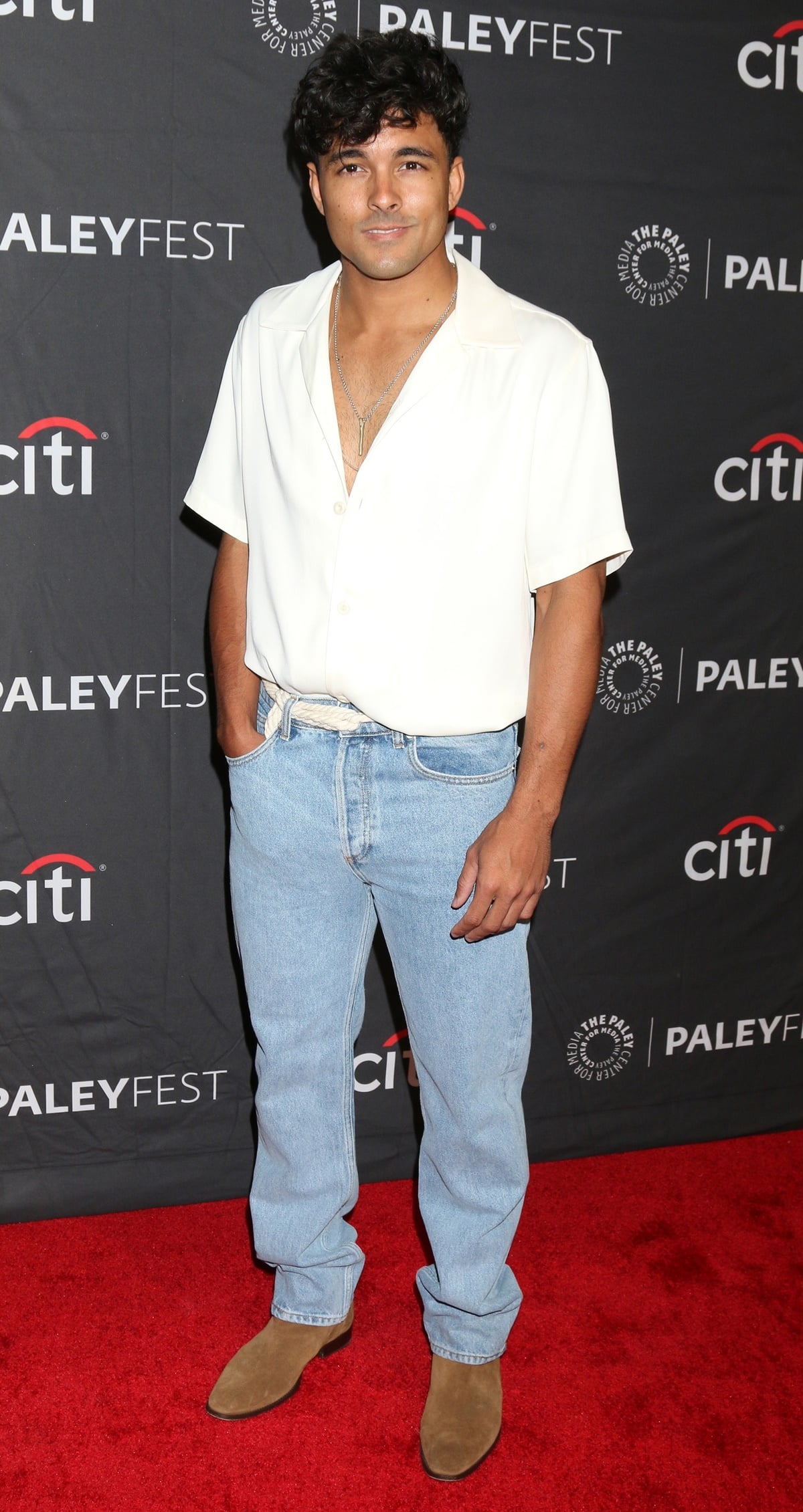 Niko Terho kept it effortlessly cool at PaleyFest LA in a relaxed cream shirt, light-wash jeans, and tan suede Chelsea boots that added a polished finish to his laid-back look