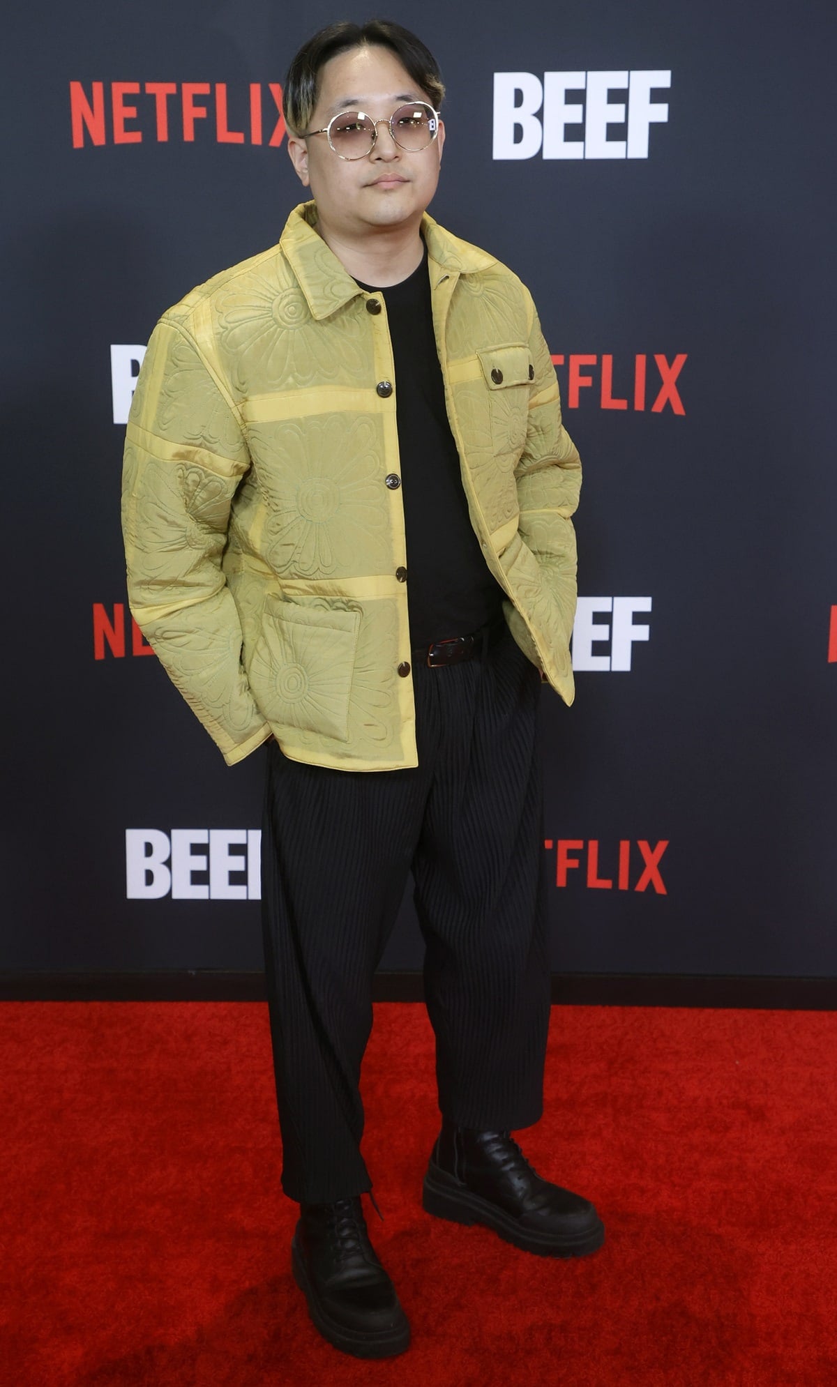 Rekstizzy brought texture and edge to the Beef premiere in a quilted yellow floral jacket, pinstriped trousers, and chunky black lace-up platform boots