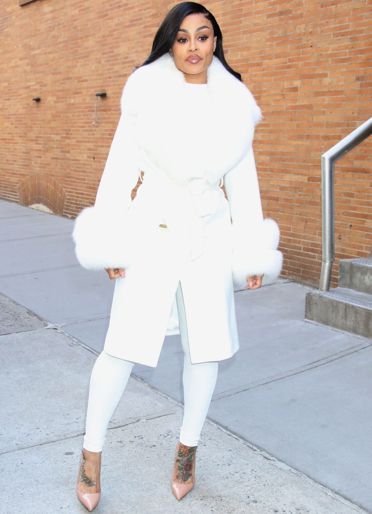 Blac Chyna made a guest appearance at the Tamron Hall Show in New York City on March 30, 2023, completing her all-white ensemble with leg-lengthening nude pumps