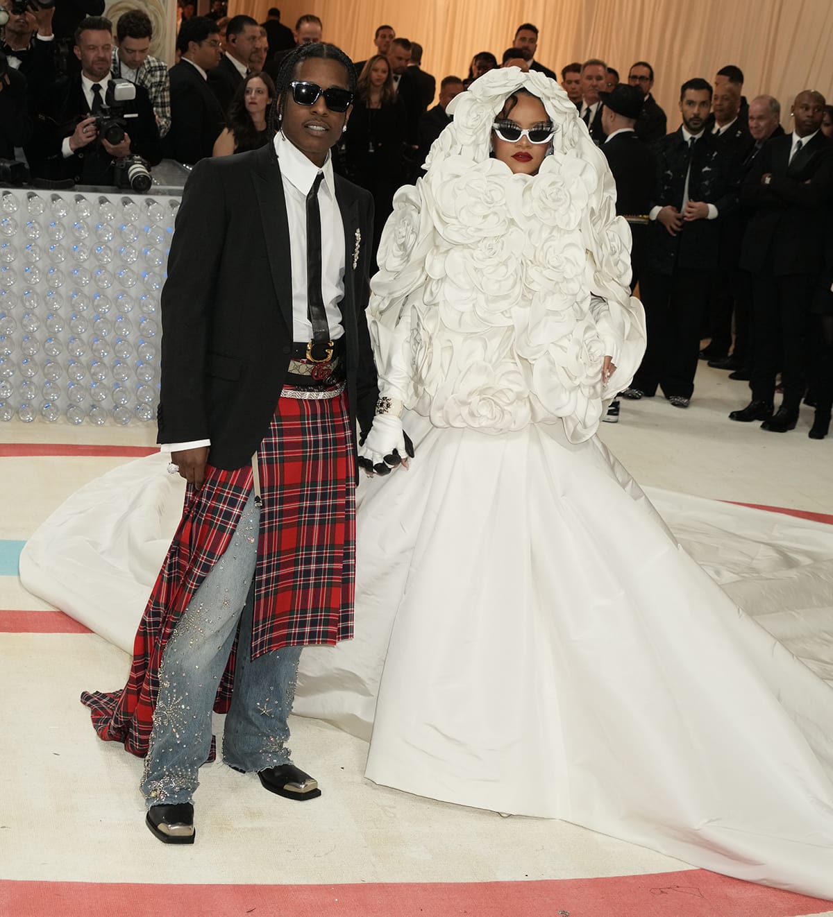 A$AP Rocky and Rihanna arrive fashionably late at the 2023 Met Gala at the Metropolitan Museum of Art on May 1, 2023, with Rihanna’s dramatic Valentino gown concealing custom white lace-up Gianvito Rossi heels beneath its sweeping train
