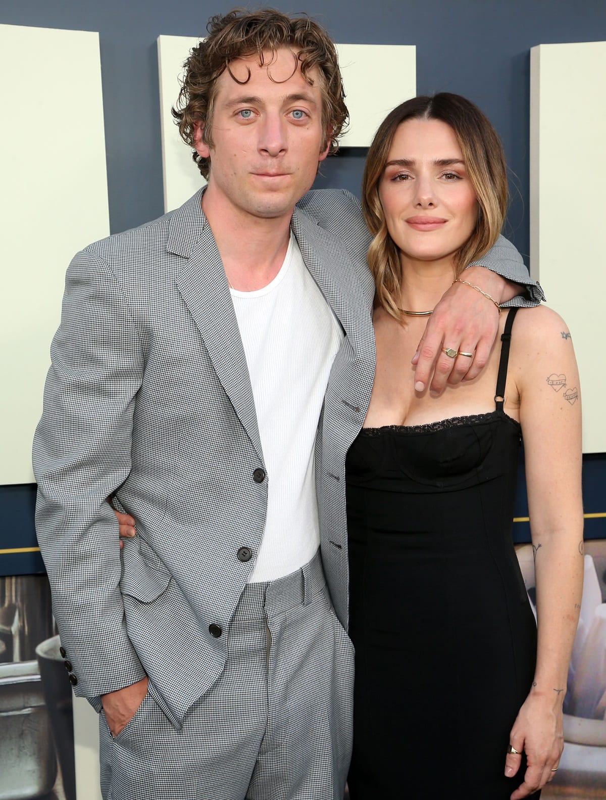 Jeremy Allen White kept it relaxed in a gray checkered suit and white tee, while Addison Timlin exuded elegance in a fitted black bustier dress with delicate lace trim