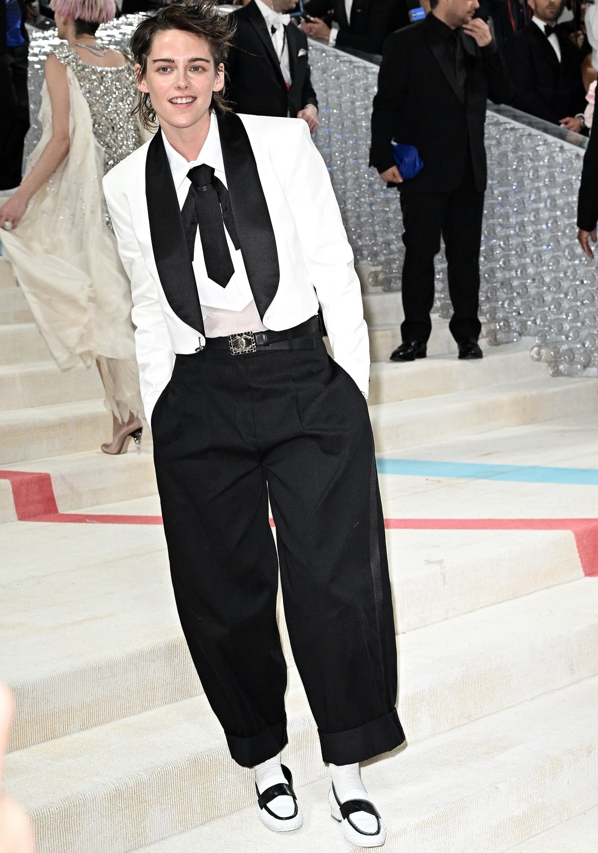 Kristen Stewart opting for an androgynous look inspired by the Chanel 2016 cruise runway show for the 2023 Met Gala