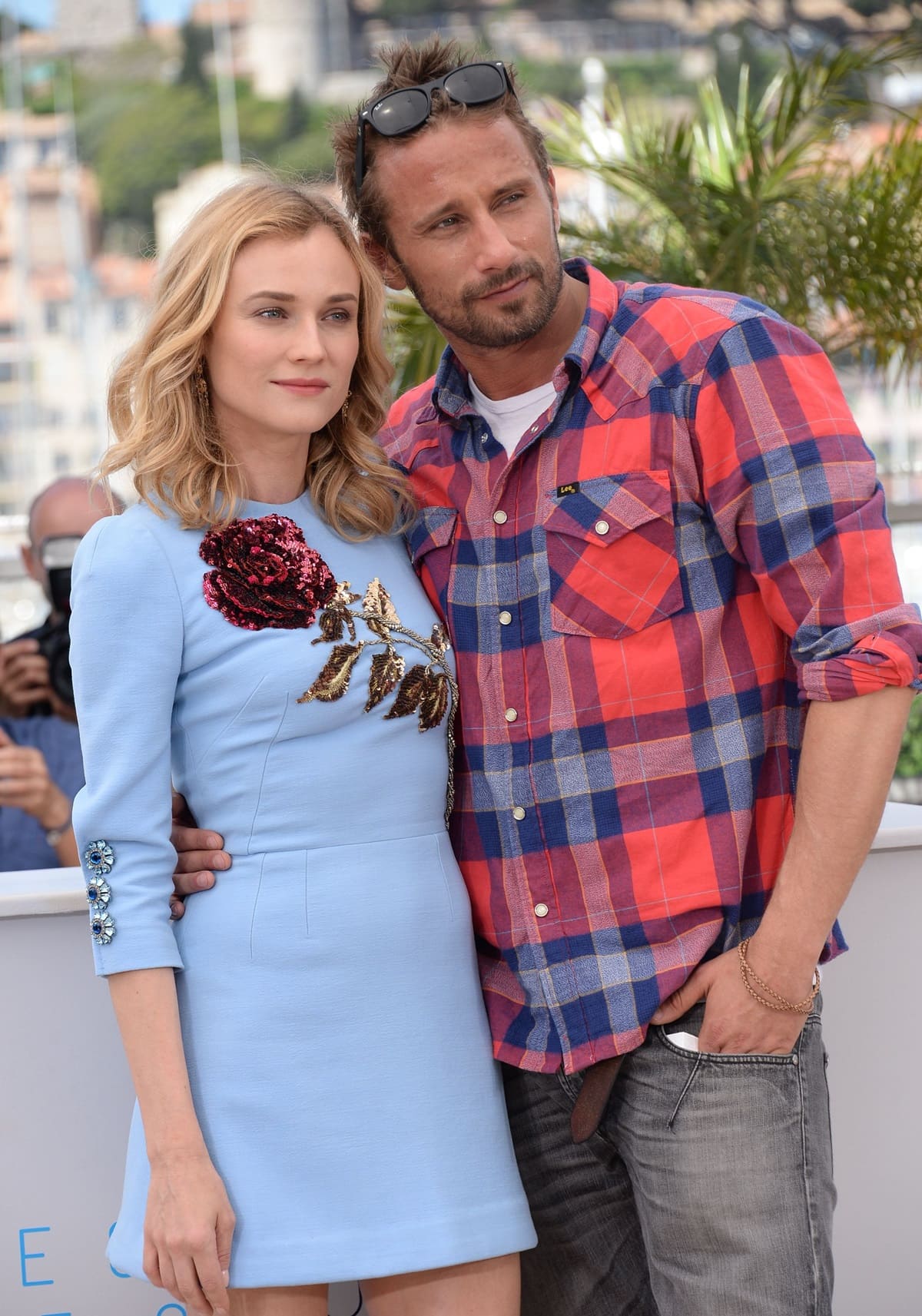 Diane Kruger and co-star Matthias Schoenaerts pose together at the Disorder photocall during the 68th annual Cannes Film Festival on May 16, 2015, with Diane stunning in a baby blue embellished mini dress and soft waves