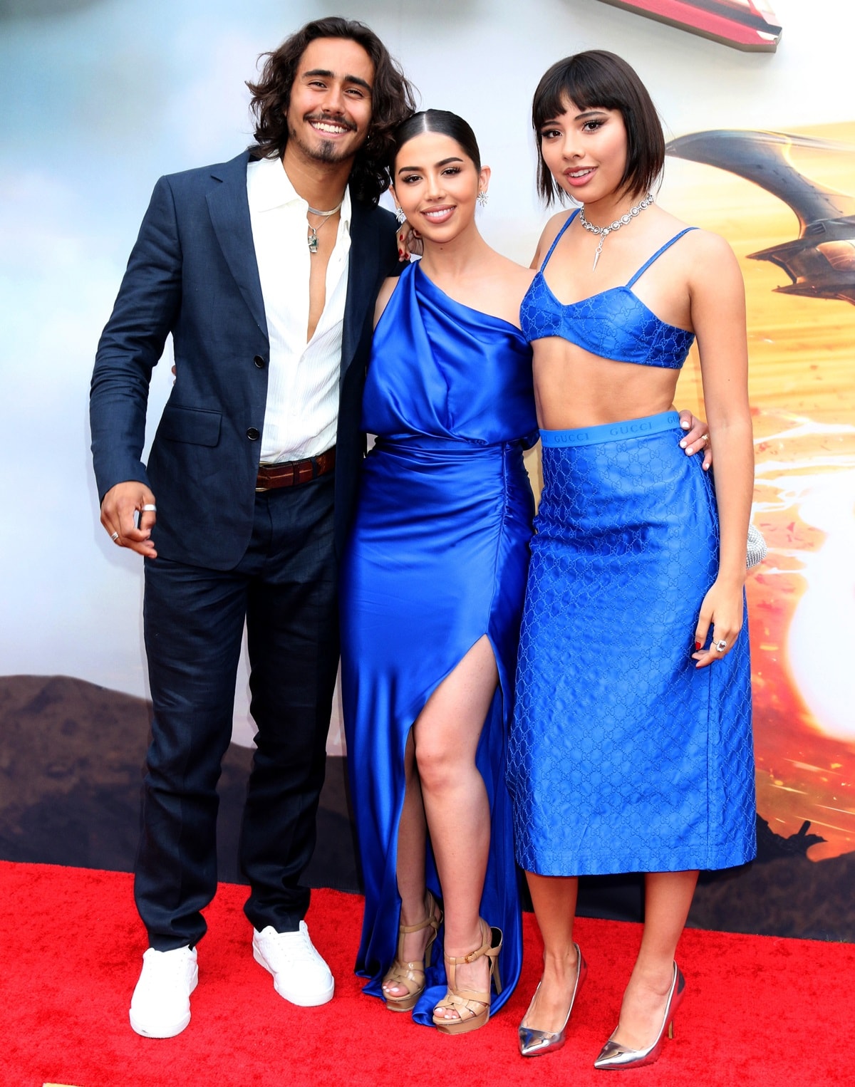 Michael Cimino kept things relaxed in a navy suit and crisp white sneakers while Amanda Diaz paired her satin cobalt gown with nude platform sandals, and Xochitl Gomez completed her vibrant blue Gucci look with mirror-finish silver pumps at The Flash premiere in Los Angeles on June 12, 2023