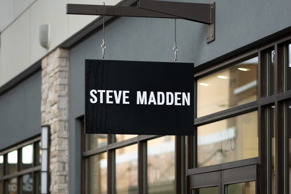 The iconic Steve Madden logo displayed on a storefront, inviting shoppers to explore the brand's latest footwear collections