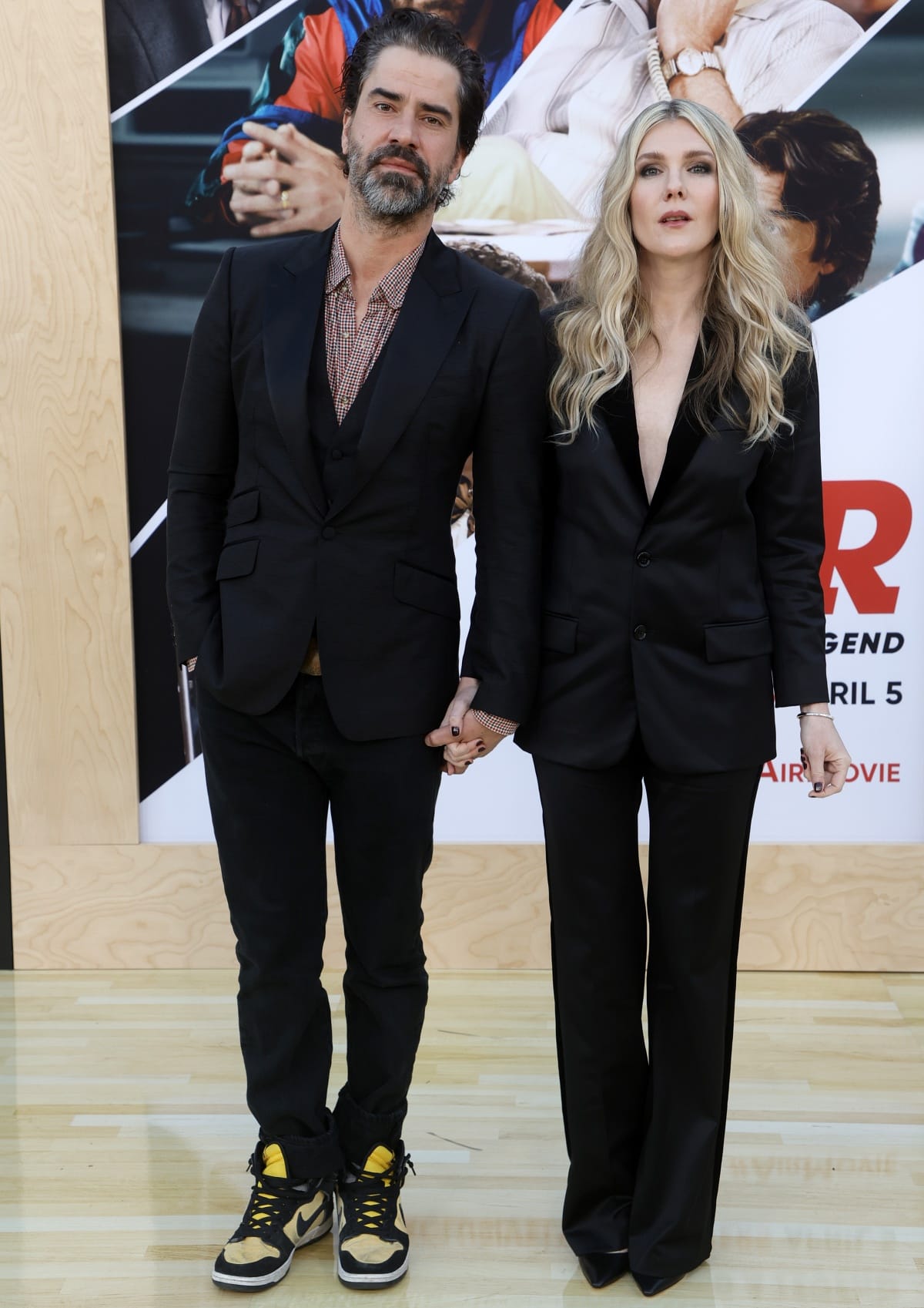 Hamish Linklater and Lily Rabe coordinated in sleek all-black looks at the AIR premiere, with Rabe wearing a sharp tailored pantsuit and pointed-toe black heels, while Linklater added a casual twist with yellow-and-black Nike high-top sneakers