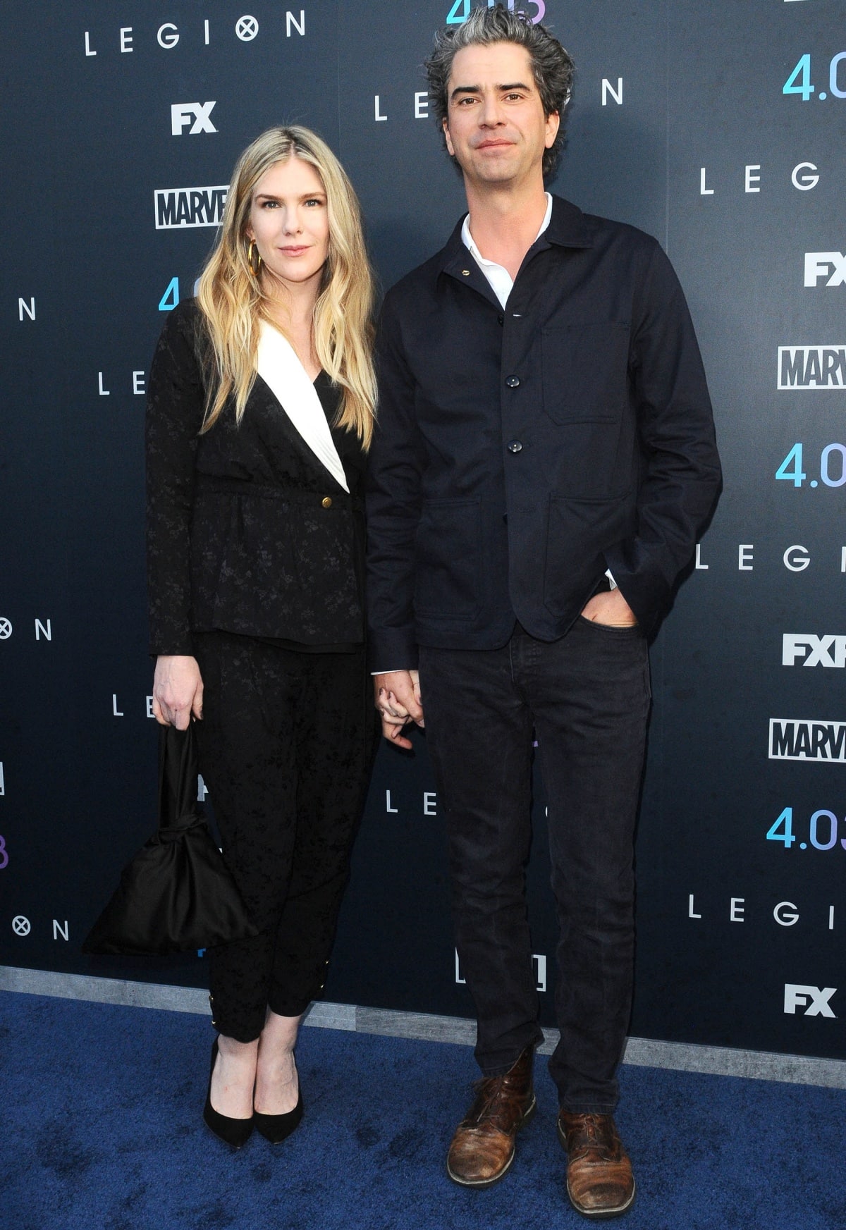 Lily Rabe wore a textured black pantsuit with a contrasting white lapel and black platform pumps while attending the Legion Season 2 premiere with Hamish Linklater, who kept it casual in a dark jacket and jeans