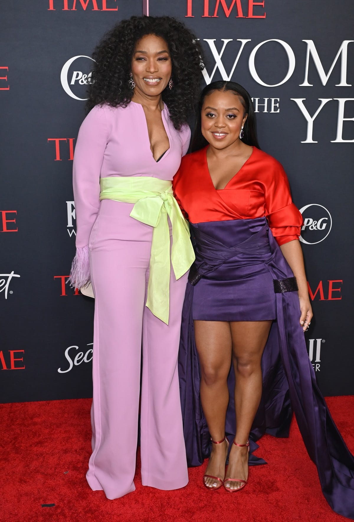 Angela Bassett stunned in a pastel pink jumpsuit with feathered cuffs and a chartreuse sash, while Quinta Brunson turned heads in a bold red and purple satin mini dress with flowing side panels and matching strappy heels