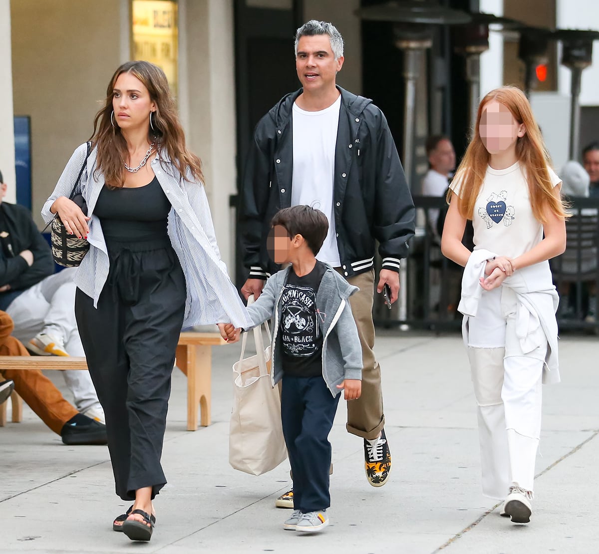 Jessica Alba steps out for dinner with husband Cash Warren and their children in Los Angeles on July 1, 2023, wearing a relaxed all-black outfit styled with casual two-strap sandals