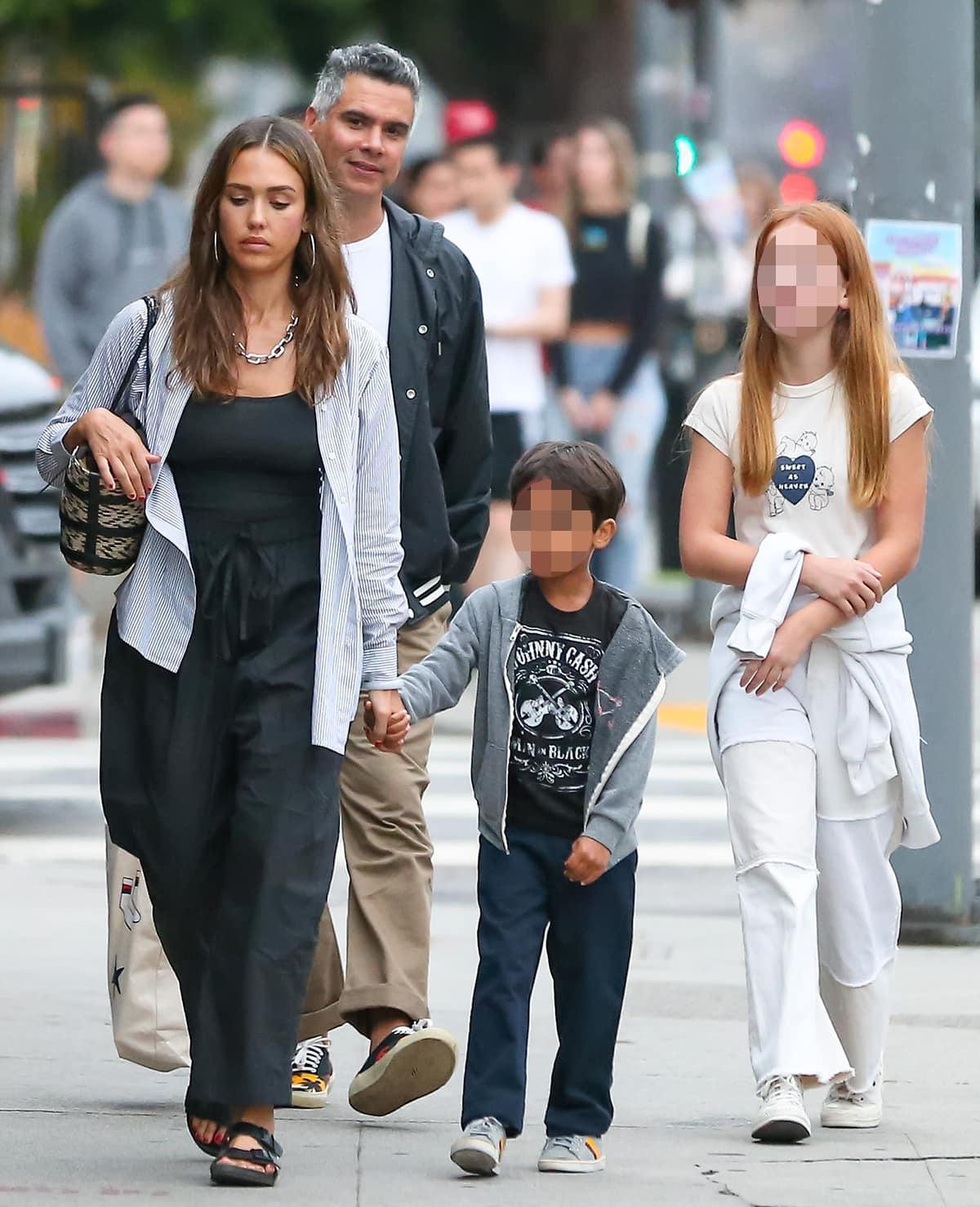 Jessica Alba heads to dinner in Los Angeles with husband Cash Warren and their children on July 1, 2023, while the rest of the family keeps things casual in sneakers and hoodies