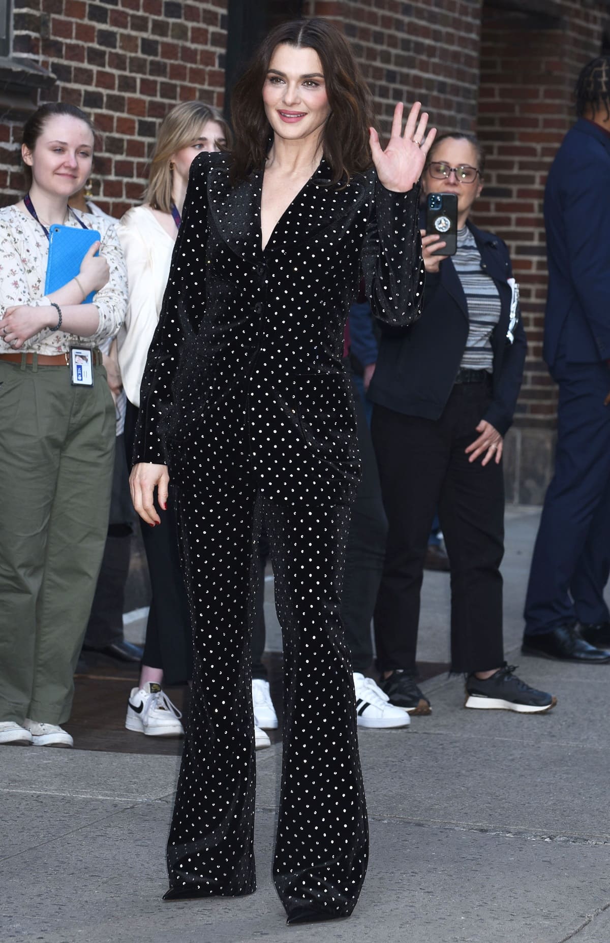 Rachel Weisz sharpened her sparkling black velvet suit from The Vampire’s Wife with elongated pointy-toe shoes that reinforced the sleek, tailored silhouette during her Late Show appearance in New York City