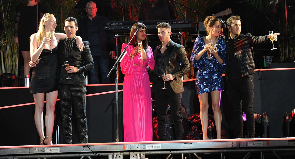 The Jonas brothers with their wives Sophie Turner, Priyanka Chopra, and Danielle Jonas at the Jonas Brothers NYE 2020