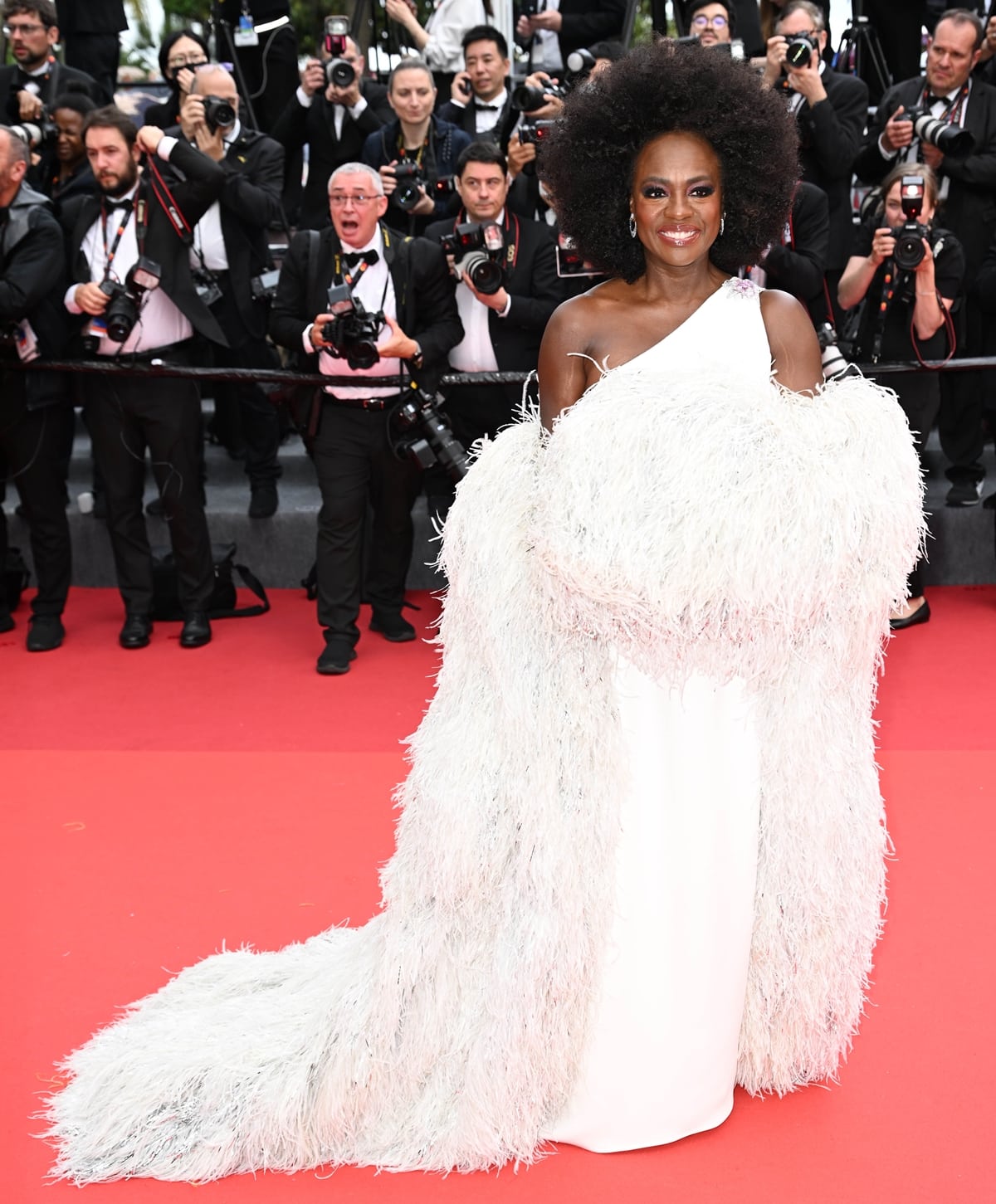 At the 2023 Cannes Film Festival, Viola Davis looked stunning in a white gown paired with a captivating feathered coat, both from Valentino couture
