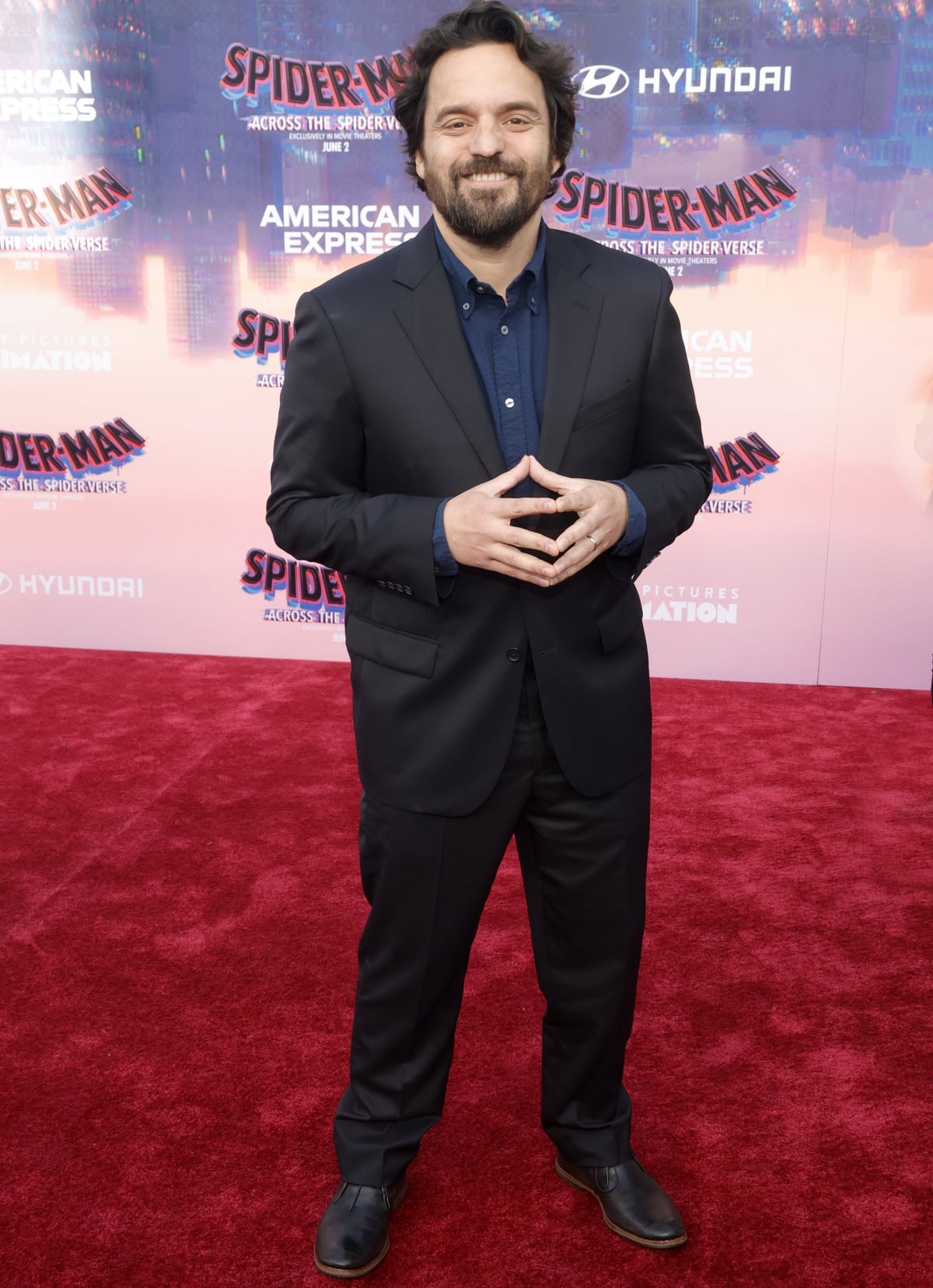Jake Johnson kept it classic at the Los Angeles premiere of Spider-Man: Across the Spider-Verse, wearing a navy shirt under a tailored black suit paired with polished leather dress shoes