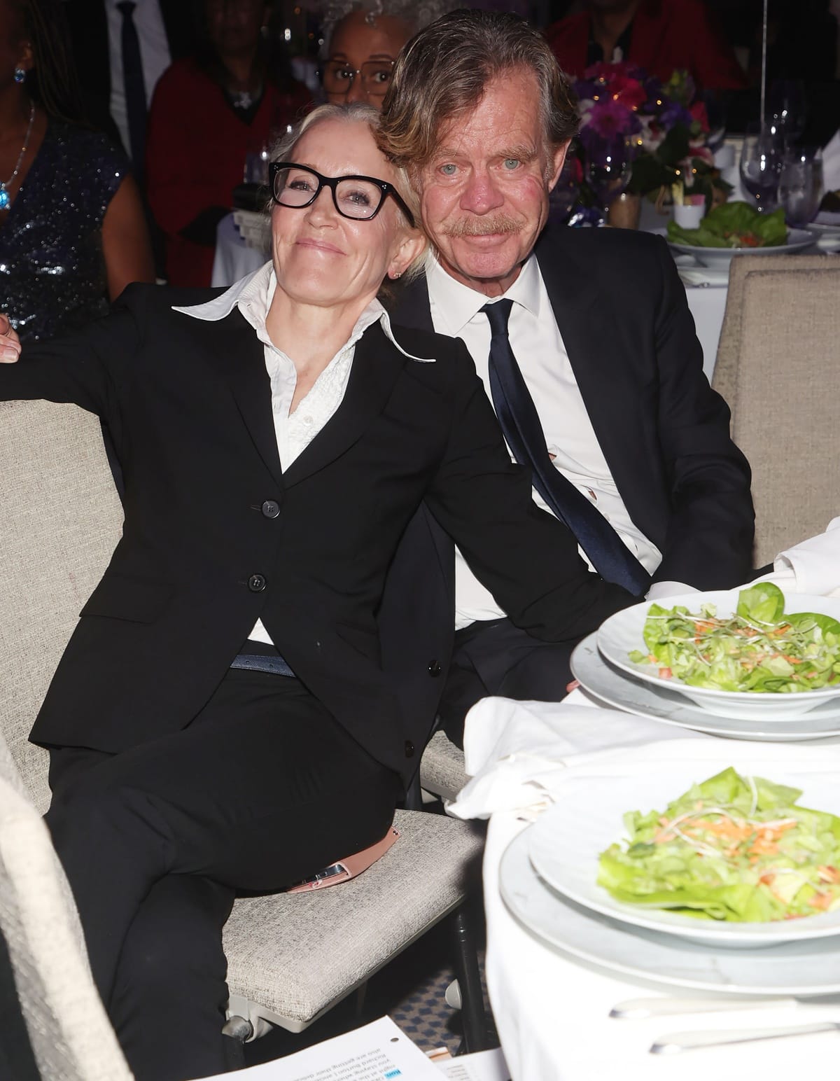 William H. Macy and wife Felicity Huffman coordinated in classic black suits at the A New Way of Life 2022 Gala in Los Angeles, California, on December 4, 2022
