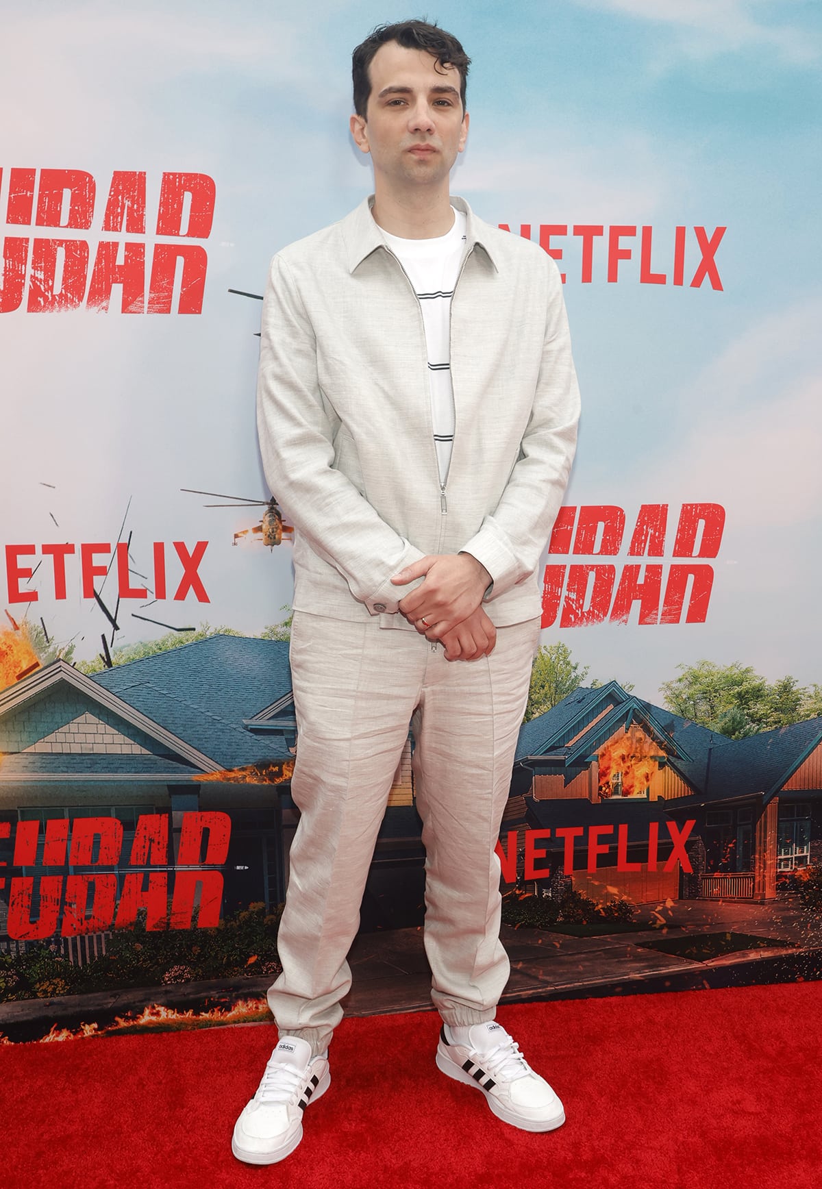 Jay Baruchel kept it cool and casual at the FUBAR premiere in a light beige zip-up set paired with classic white adidas sneakers featuring black stripes for a sporty finish