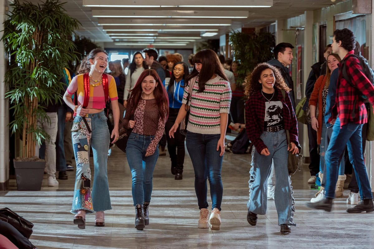 Sara Waisglass, Katie Douglas, Chelsea Clark, and Antonia Gentry bring their distinct teen fashion styles to the halls of Ginny Georgia, showcasing vibrant colors, trendy denim, and playful layering
