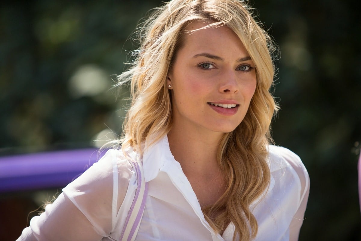 Margot Robbie exudes youthful charm as Charlotte in the 2013 romantic comedy-drama About Time, marking one of her earliest feature film appearances