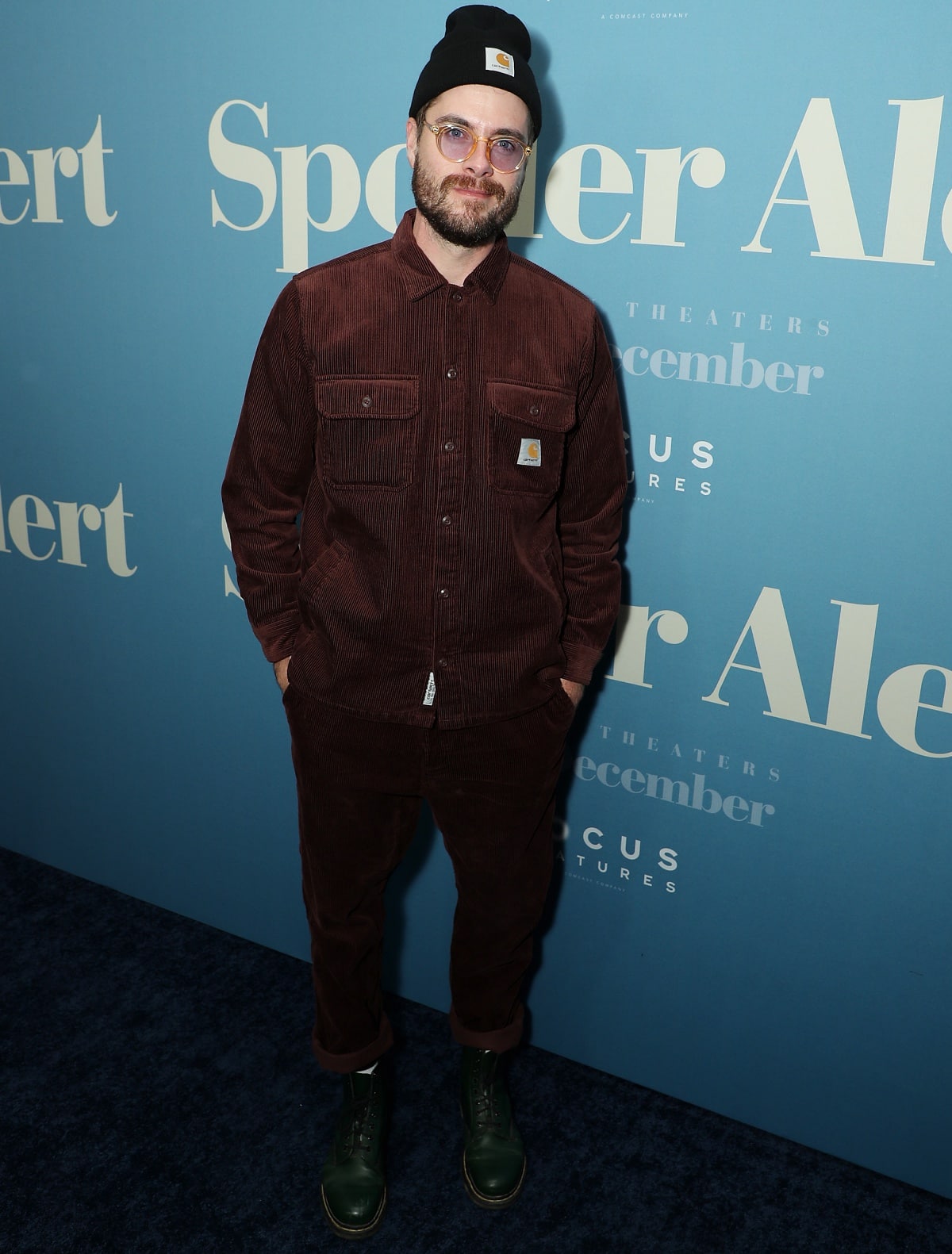 Jeffery Self adds a laid-back edge in a burgundy corduroy Carhartt set, cuffed pants, and dark green leather lace-up boots at the premiere of Spoiler Alert in New York City on November 29, 2022